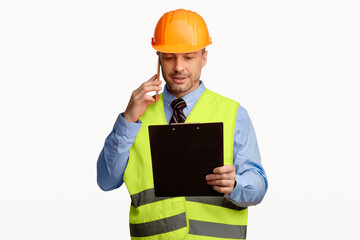 Repairman Worker Talking On Cellphone Holding Folder Standing In Studio On White Background. Handyman Service Concept