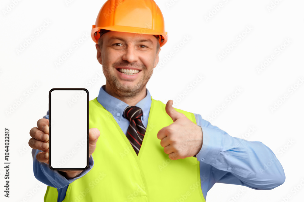 Poster Construction Worker Showing Smartphone Empty Screen Gesturing Thumbs-Up, Recommending Architectural And Building Services On White Background. Selective Focus