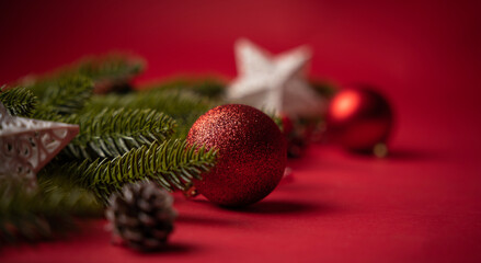 Closeup image of Christmas ornaments isolated on red background