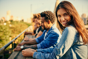 Portrait, rooftop and smile of woman with friends outdoor in city for holiday, travel or vacation together. Face, relax and summer with happy people outdoor in urban town for sightseeing or view