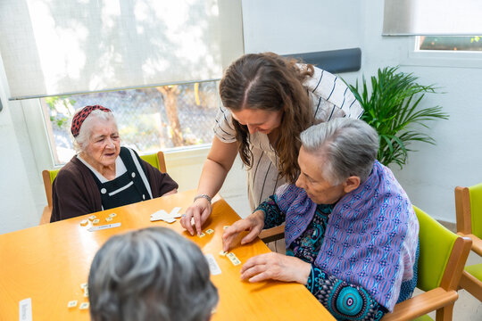 Senior women playing skill board games in the geriatrics