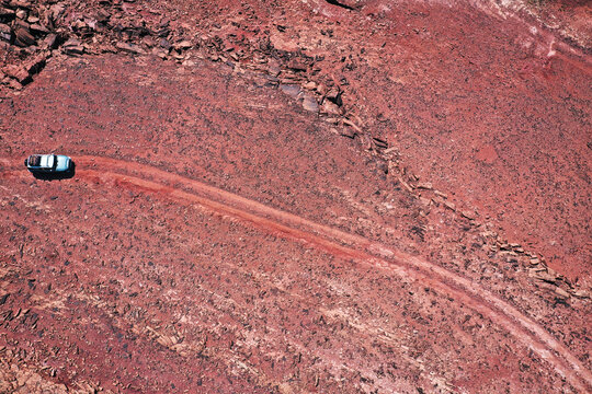 Aerial view of a vehicle  track in the red sand desert in Tabuk province