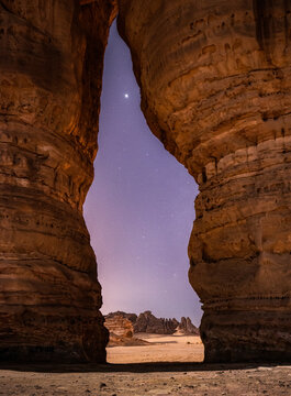 Gate rock formation in Al Ula showcasing Venus in clear desert sky