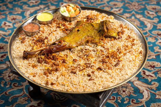 Mutton mandi with vegetables and sauces