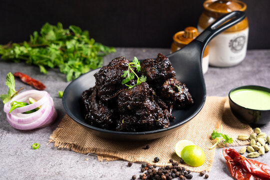 Roasted jerk chicken wings dish with sauce