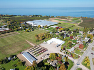 Aerial over Louth, rural north St. Catharines, Ontario, Canada and Lake Ontario near the Port Dalhousie area viewing northwest from Martindale on a sunny Autumn day in October, 2024.