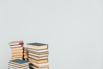 Stacks of educational books for teaching in the library on a white background