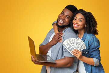 Wise Investment. Portrait Of Happy African Couple With Laptop And Dollar Cash In Hands
