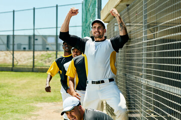 Sports team, men and celebration with baseball field training for game challenge, outdoor exercise or workout. Arms up, summer competition and athlete in safety gear ready for practice in uniform