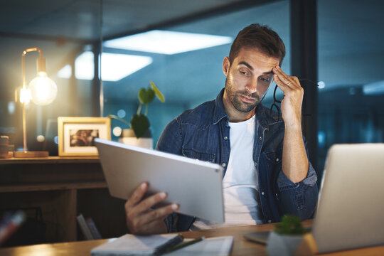 Businessman, headache and stress of reading on laptop with stock market crash, burnout or overworked. Employee, trader or migraine at desk in office for investment mistake or economy crisis at night
