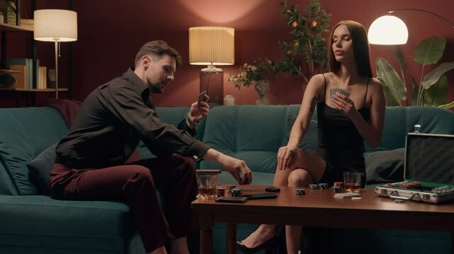 Caucasian family rich couple playing poker drinking happy man male guy smiling boyfriend gambling win bet victory woman female sad upset girl girlfriend losing competition defeat casino dating at home
