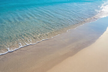Crystal-clear turquoise water gently washes over soft, golden sand, serene and peaceful beach scene. sunlight reflection producing calming, natural ambiance. for vacation themes, relaxation designs