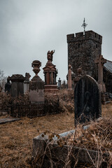 spooky old cemetery with ancient headstones