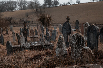 spooky old cemetery with ancient headstones