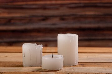 Unlit candles, scene with various objects and recently extinguished candles. Selective focus.