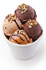 A delicious assortment of rich chocolate, creamy vanilla, and nutty ice cream scoops topped with crunchy nuts and chocolate drizzle in a white cup.