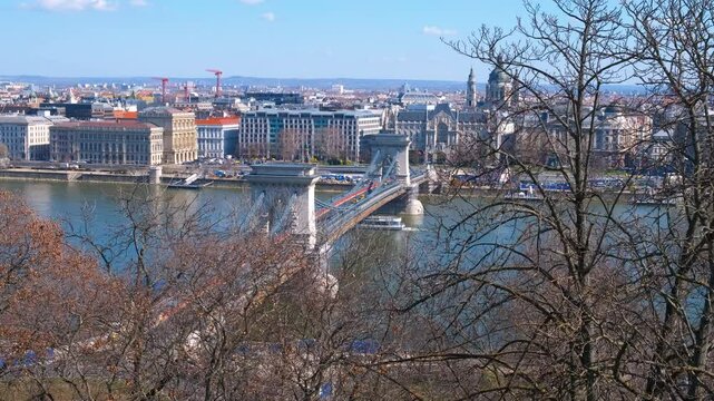 Cars on Secheni Bridge through Danube. A view of traffic on Secheni bridge to Budapest historic city center in the sun light.