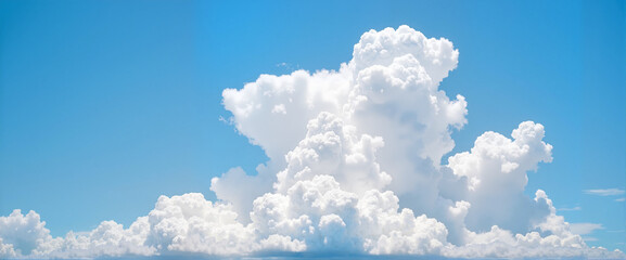 Fluffy white clouds in bright blue sky