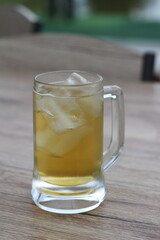 full glass of beer on table at the restaurant
