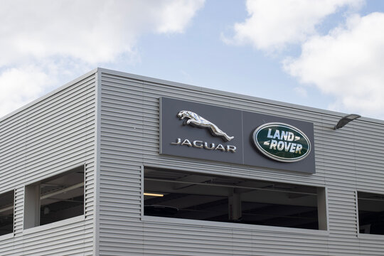 Tigard, OR, USA - May 17, 2022: Jaguar and Land Rover logos are seen at a dealership store in Tigard, Oregon. Jaguar Land Rover Automotive PLC is the holding company of Jaguar Land Rover (JLR).