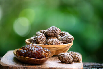 Malva nut or Scaphium macropodum Beaum dried fruits and jelly on natural background.