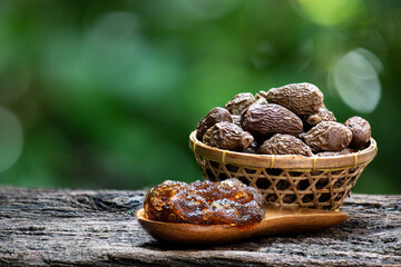 Malva nut or Scaphium macropodum Beaum dried fruits and jelly on natural background.