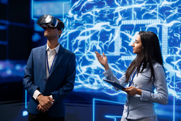 Technology company CEO using conference as platform to present latest AI and VR headsets products....