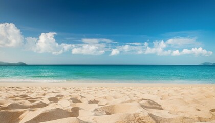 Fototapeta premium Empty sand beach in front of summer sea background with copy space