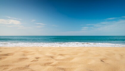 Fototapeta premium Empty sand beach in front of summer sea background with copy space