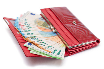 Red Leather Women Purse with Different Euro Banknotes - Isolated on White Background. A Wallet Full of European Union Paper Money Symbolizing Wealth, Success and Social Status - Isolation