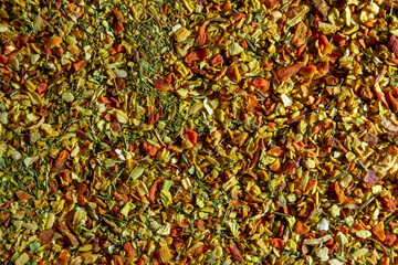 Vibrant and Colored Vegetable Seasoning Mix: A Culinary Canvas of Aromatic Seasoning - Textured Background for Gourmet Cooking. The Harmonious Combination of Fresh Herbs and Spices - Top View