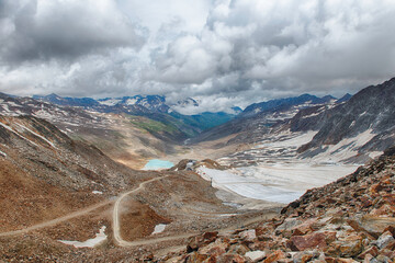 Schnalstal Glacier melting under dramatic sky in Italian Alps