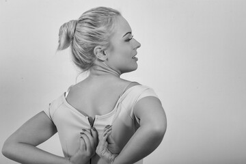 Woman struggling to close dress zipper at home © Giulio_Fornasar