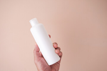 Cosmetic bottle mockup, with cream background, mockup for your product branding