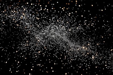 Abstract night sky with stars, white dots on black background, pointillism glitter texture wallpaper