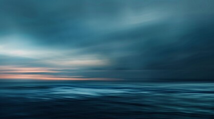 Obraz premium A serene yet intense seascape capturing a vast and mysterious ocean under a moody twilight sky, blending hues of deep blue and fading sunlight on the horizon.