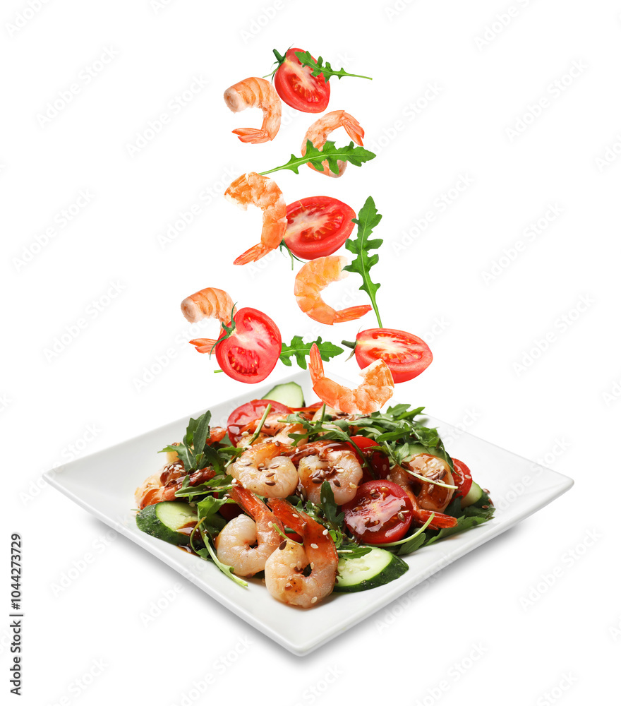 Wall mural Shrimps and other ingredients falling onto plate on white background