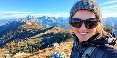 young woman takes a selfie while on a hike in nature