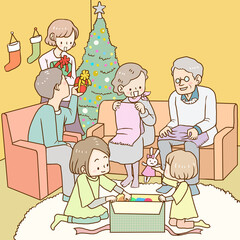 クリスマスプレゼントを開けて楽しそうに家族で過ごす夜