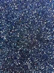 Fall foliage in a blend of amber, gold, and rust colors, captured under soft lighting that accentuates the leaf textures and seasonal atmosphere.