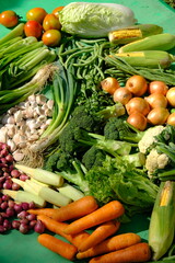 Sayur Mayur Sayuran Segar is fresh vegetables from the tropics. there are carrots, mustard greens, onions, garlic, long beans, broccoli, sweet corn, cucumbers, squash, lettuce, potatoes, leeks, celery