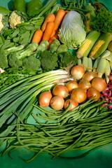 Sayur Mayur Sayuran Segar is fresh vegetables from the tropics. there are carrots, mustard greens, onions, garlic, long beans, broccoli, sweet corn, cucumbers, squash, lettuce, potatoes, leeks, celery