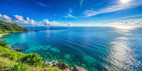 Fototapeta premium A Tranquil View of a Lush Coastal Landscape with Sparkling Blue Waters Under a Clear Sky