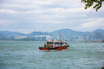 Fototapeta premium Hong Kong, China - City skyline and cruise ship