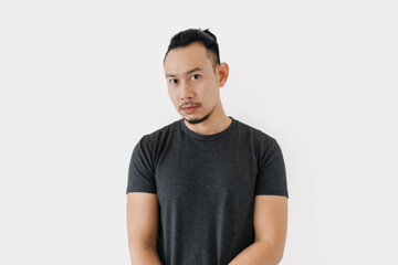 Fototapeta premium Normal face Asian freelance man bun hair in black on white.