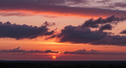 Naklejka premium Sunset casting warm hues over the horizon with scattered clouds background picturesque scene inviting admiration of nature colorful displays