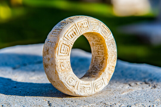 pok ta pok stone ring carved with Mayan glyphs from ancient ball court