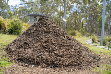 measuring the temperature of a Compost pile, organic thermophilic compost turning in Tasmania Australia