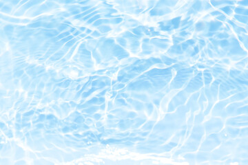 Blue water with ripples on the surface. Defocus blurred transparent blue colored clear calm water surface texture with splashes and bubbles. Water waves with shining pattern texture background.