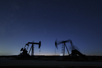 The comet streaking across the night sky over Texas oil field